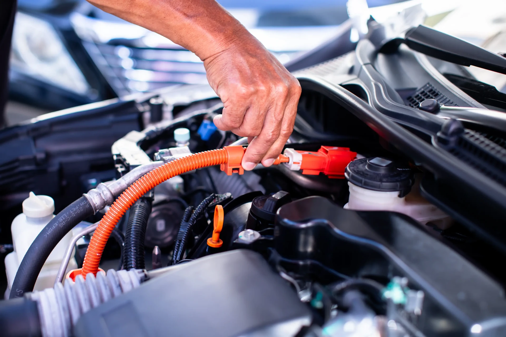 Mechanic working on a car air conditioning system