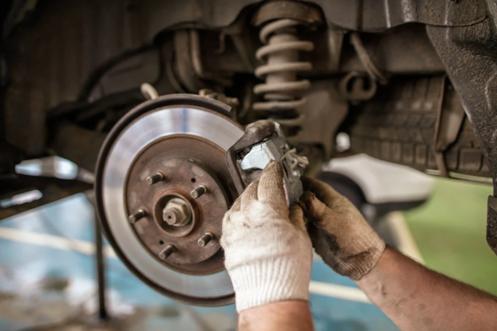 Brake disc and caliper on a car wheel hub