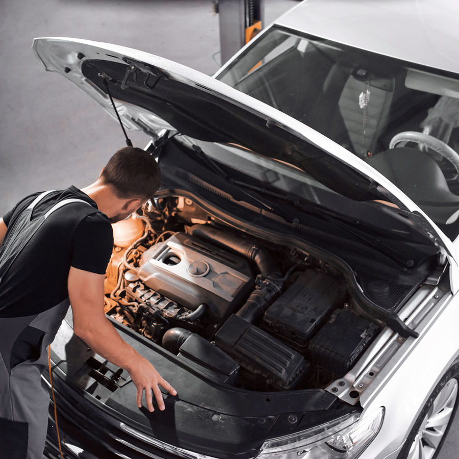 Mechanic working on a car in the workshop