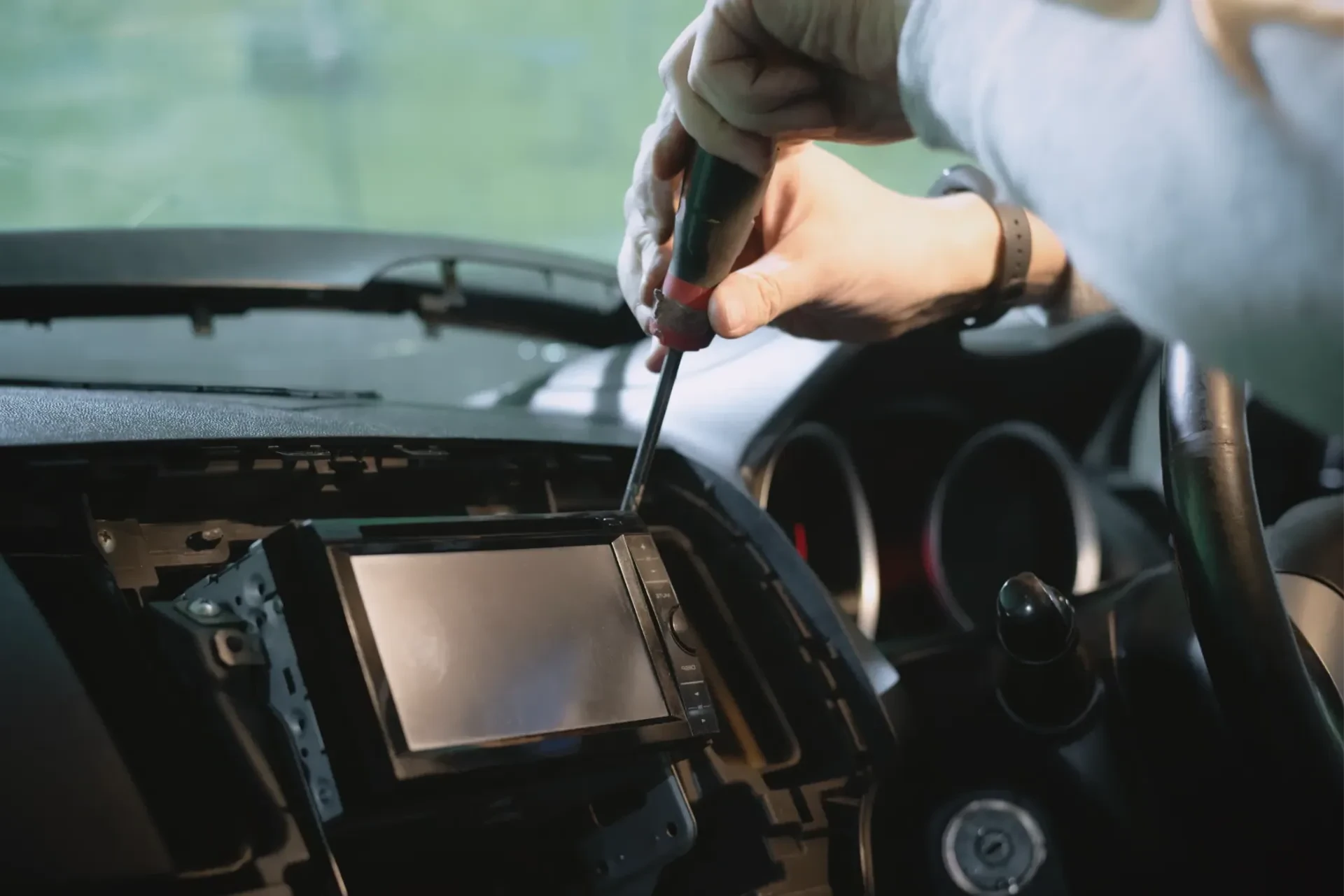 Car stereo and wiring being installed in a dashboard